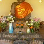 Typical offerings of food, flowers and incense