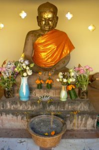 Typical offerings of food, flowers and incense