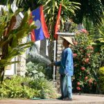 Watering plants at upscale hotel