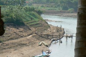 Boys playing along the Nam Khan River. The Nam Khan River