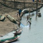 Boys playing along the Nam Khan River. The Nam Khan River