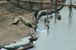 Boys playing along the Nam Khan River. The Nam Khan River