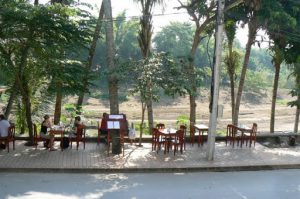 Dining tables along the Nam Khan river