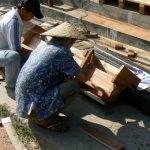 Carpenters repairing steps along the main street