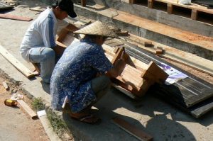 Carpenters repairing steps along the main street