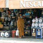 Monks browsing an abundance of goods