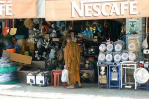 Monks browsing an abundance of goods