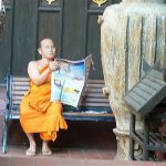 Monk reading the latest news