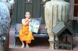 Monk reading the latest news