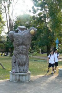 Torso sculpture with animal designs in Tung and Kim
