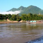 Moving north along the Mekong River after the morning mist