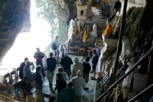 Tourists looking at the lower cave and sculptures