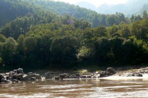 Muddy river and green hills