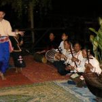 Ethnic dance and music troupe entertaining tourists