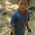 Boy with home-made slingshot