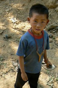 Boy with home-made slingshot