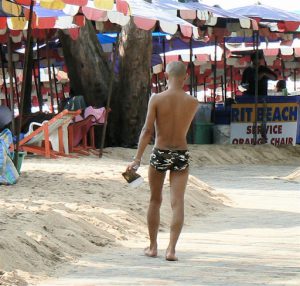 Lightly clad beach boy, Jomthien Beach