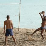 Volleyball game on gay beach