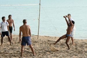 Volleyball game on gay beach