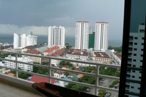 Overview of Jomthien condo towers along the coast.