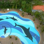 Looking down on a swimming pool from 20th floor