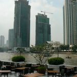 Chau Phraya River runs through Bangkok with huge hotels and