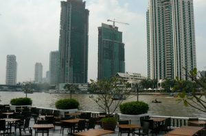 Chau Phraya River runs through Bangkok with huge hotels and