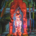 Buddhist shrine in front of a bank