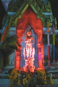 Buddhist shrine in front of a bank