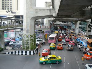 Colorful dense traffic along Sukumvit Road  (below the Skytrain superstructure)