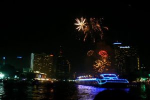 Fireworks and large illuminated rafts on the Chao Phraya River,