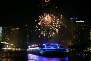 Fireworks and large illuminated rafts on the Chao Phraya River,