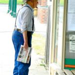 Local man checking out the local news.