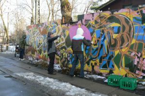 The fence is frequently redecorated by resident artists