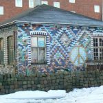 Painted brick mosaic facade of a private house; properties are