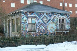 Painted brick mosaic facade of a private house; properties are