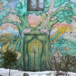 Multicultural fantasy mural at entry to Christiania