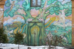 Multicultural fantasy mural at entry to Christiania