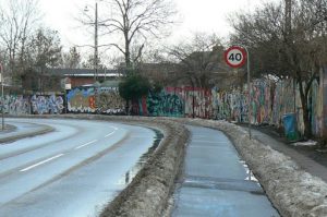 Along the periphery of Christiania is a long fence decorated