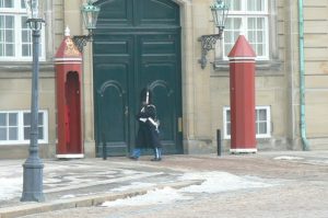 Royal guards patrol the Amalienborg Palace plaza