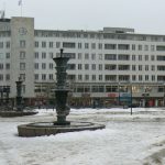 City square with shops and fountains