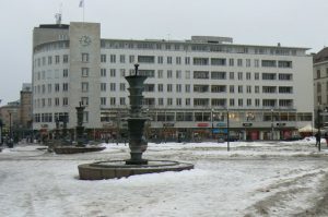 City square with shops and fountains