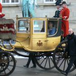 The queen and her husband pass by