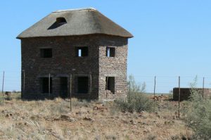 Abandoned thatch-roofed building in the plains