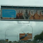 Billboard at airport using Buddhist monks in a telephone ad
