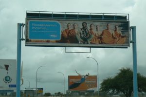 Billboard at airport using Buddhist monks in a telephone ad