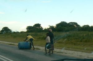 Heading home with a barrel full of water