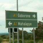 Road sign along highway; colors and letters similar to USA