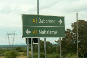 Road sign along highway; colors and letters similar to USA