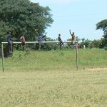 Kids waving hello north of Okavango Delta